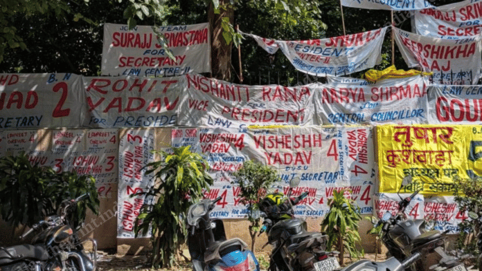 Campaign banners across an outer wall of the Campus Law Centre ahead of Delhi University Students Union elections | Himanshi Aggarwal | ThePrint