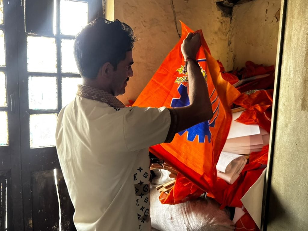 Anil Kumar who lives alone is organising the flags at BMS office's store room | Sagrika Kissu, ThePrint