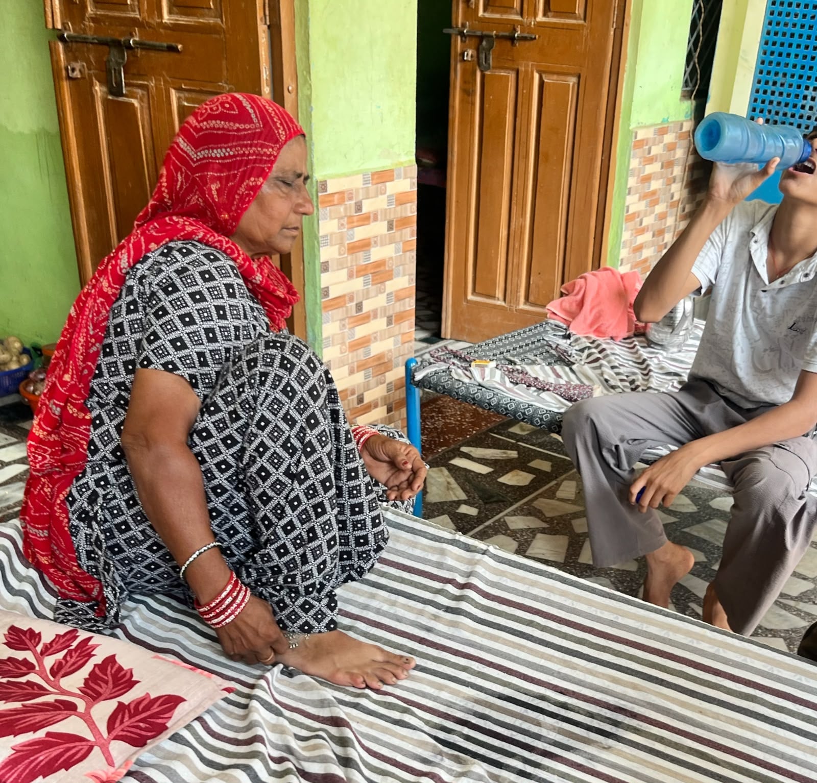 Aarti’s grandmother, Roshni, and her younger brother at their residence in Arya Nagar. They say she brought shame to the family | Saqiba Khan/ThePrint