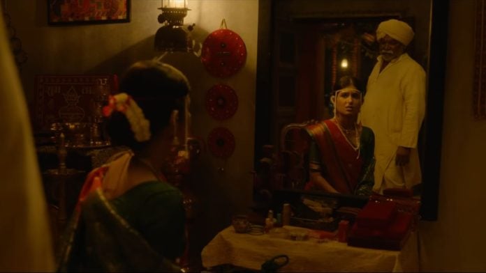 A still of Ishita Deshmukh and Kishor Kadam in the trailer for 'Gondhal' | YouTube