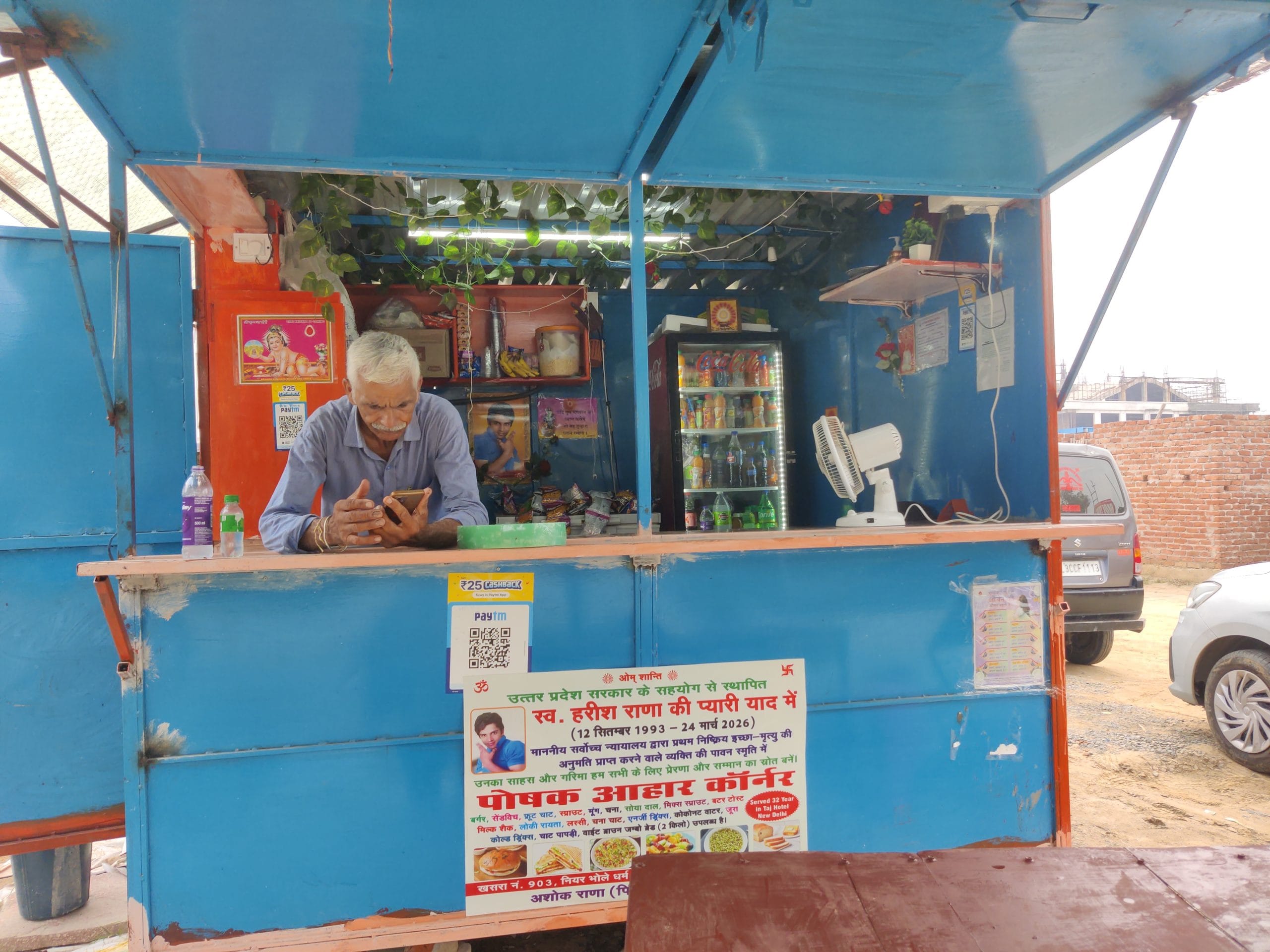 Ashok Rana’s blue food kiosk, Poshak Aahar Corner, has given his days a new routine after years spent organising life around his son’s care | Vitasta Kaul, ThePrint