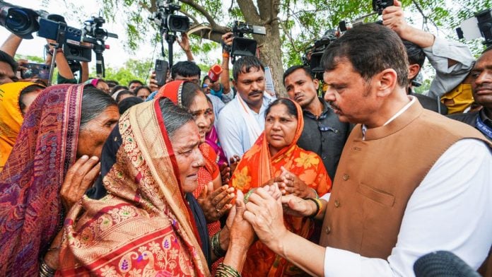 Maharashtra CM Devendra Fadnavis interacts with distressed farmers during his visit to inspect drought-affected areas in Kharosa village of Ausa taluka in Latur Wednesday | @CMOMaharashtra X/ANI Photo