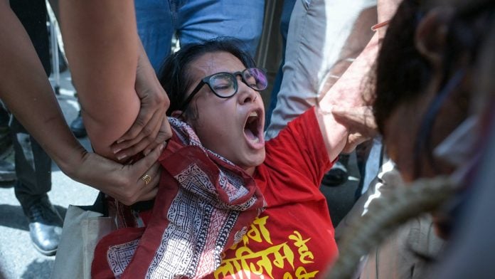 Delhi Police detain protesters from various organisations who were staging a demonstration near Jantar Mantar against Chief Election Commissioner Gyanesh Kumar. ThePrint photo by suraj Singh Bisht.