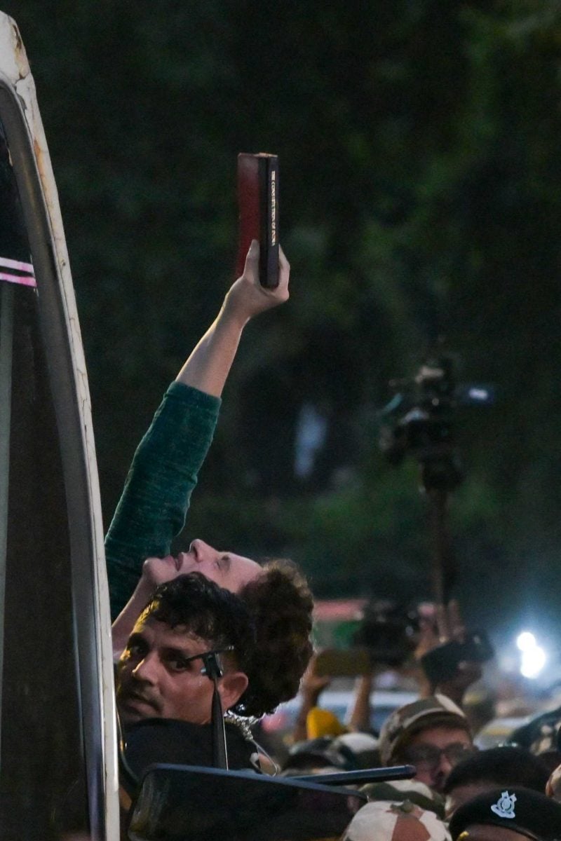Congress leader Priyanka Gandhi Vadra holds a copy of constitution of india while being detained by Police | Suraj Singh Bisht | ThePrint