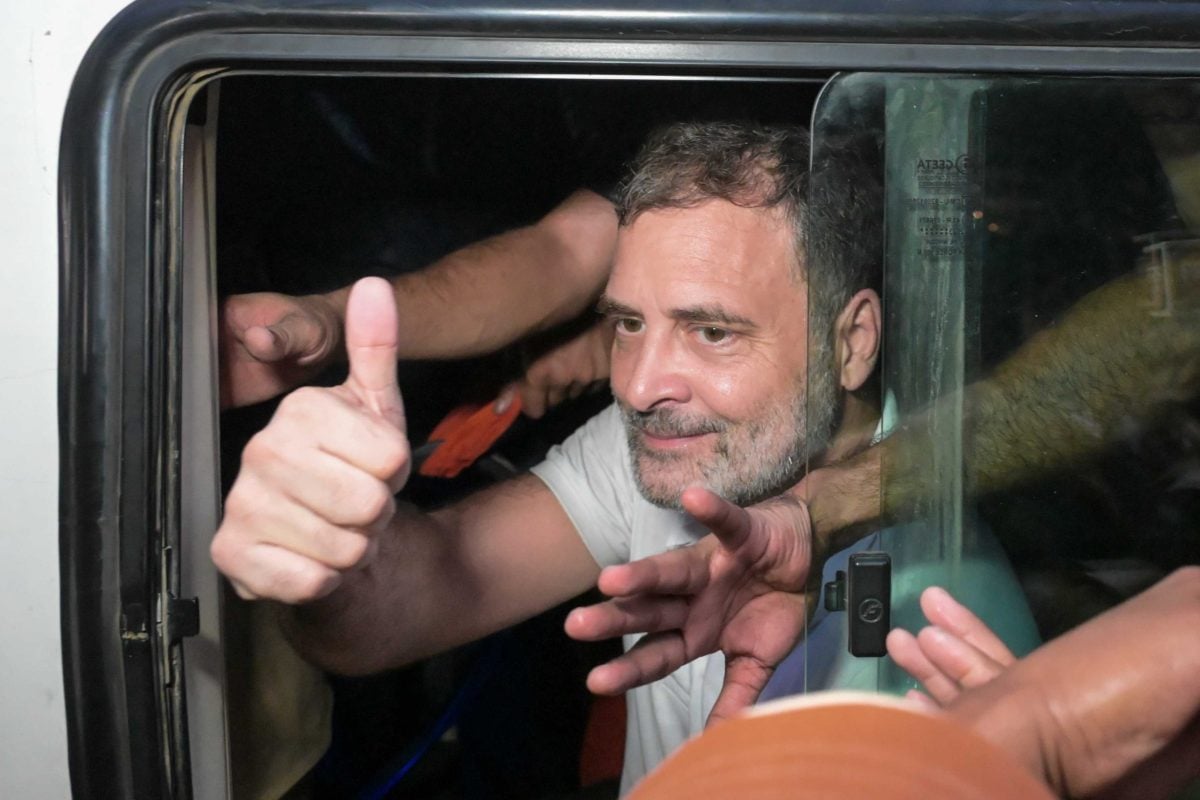 Leader of Opposition Rahul Gandhi gestures with his thumb while being detained by the police | Suraj Singh Bisht | ThePrint