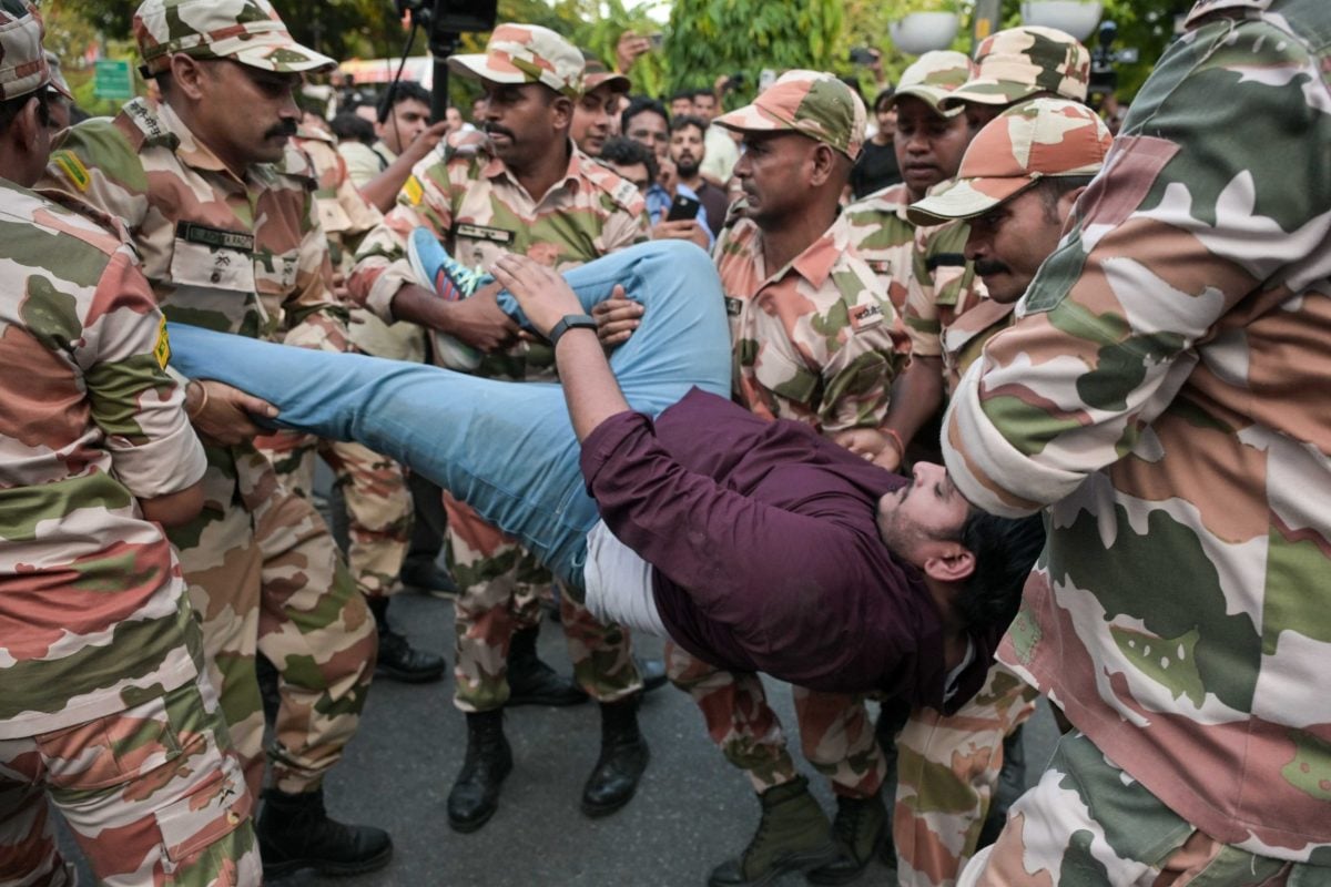 Congress supporters being detained by the security forces during a protest | Suraj Singh Bisht | ThePrint