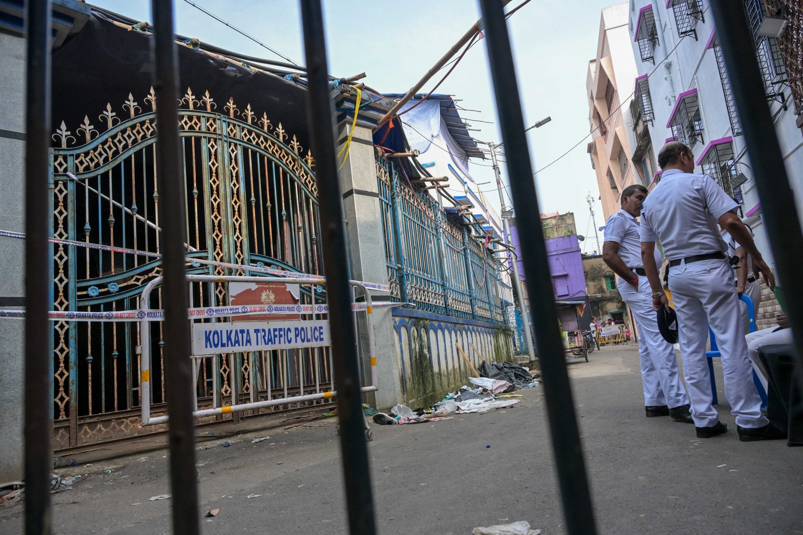 Police stand guard outside the Chorebagan Sarbojanin Durga Puja pandal on Sunday, a day after the stampede | Suraj Singh Bisht | ThePrint