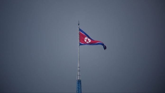 A North Korean flag flutters at the propaganda village of Gijungdong in North Korea, in this picture taken near the truce village of Panmunjom inside the demilitarized zone (DMZ) separating the two Koreas, South Korea, July 19, 2022. REUTERS/Kim Hong-Ji/Pool
