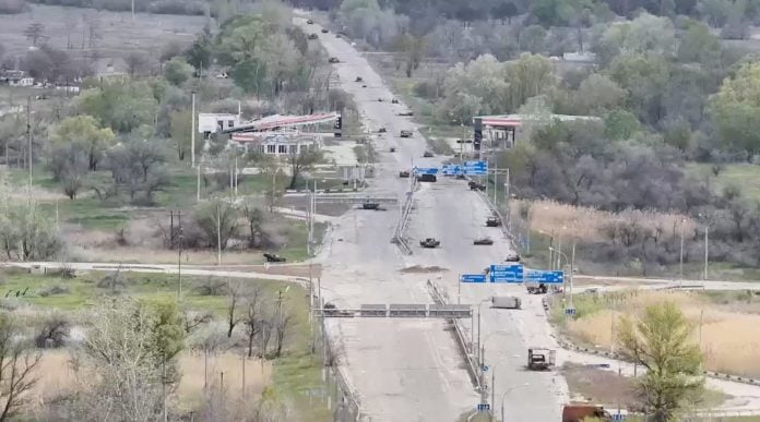 A still image taken from an undated drone video showing destroyed vehicles sitting on a street in Oleshky, Kherson Region, Russian-controlled Ukraine | REUTERS