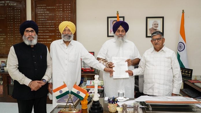 Shiromani Akali Dal President Sukhbir Singh Badal and others hand over a memorandum to Punjab Governor Gulab Chand Kataria over the killing of anti-drug activist Parvinder Singh Jhota, on Friday. (@officeofssbadal X/ ANI Photo)