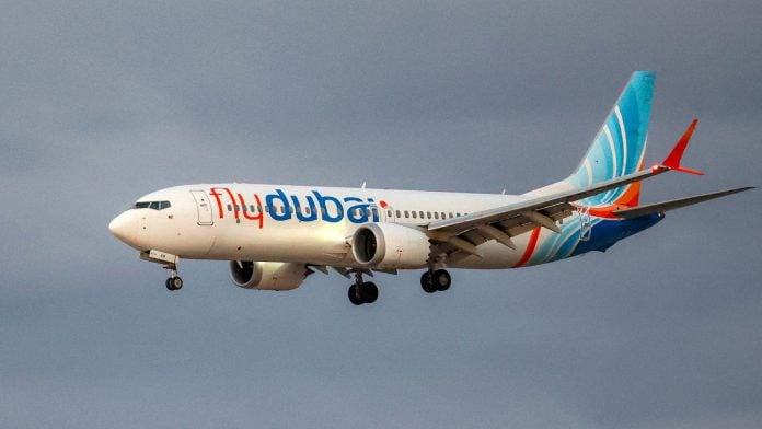 A Flydubai aircraft prepares for landing at Israel's Ben Gurion Airport in Lod on Sept. 30. Photographer: Jack Guez/AFP/Getty Images | Bloomberg