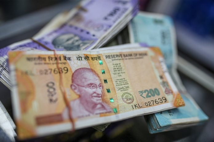 Indian rupee banknotes arranged for a photograph at general store in Mumbai, India, on Wednesday, July 20, 2022. Photographer: Dhiraj Singh/Bloomberg