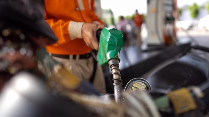 An attendant refuels a motorcycle at an Indian Oil Corp. gas station in Noida, Uttar Pradesh, India. Photographer: Anindito Mukherjee/Bloomberg