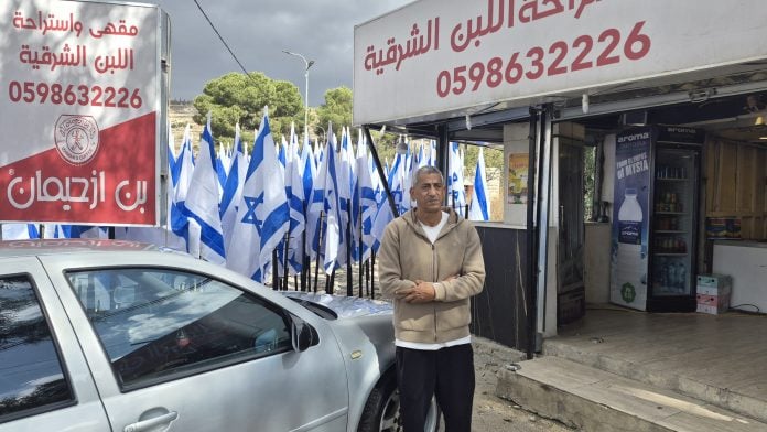 Muayyad Hussein outside his roadside kiosk on Route 60 in the West Bank.Photographer: Marc Champion/Bloomberg
