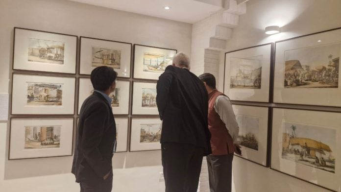 Visitors leaning in to spot Solvyns in the etching | Maryam Hassan, ThePrint