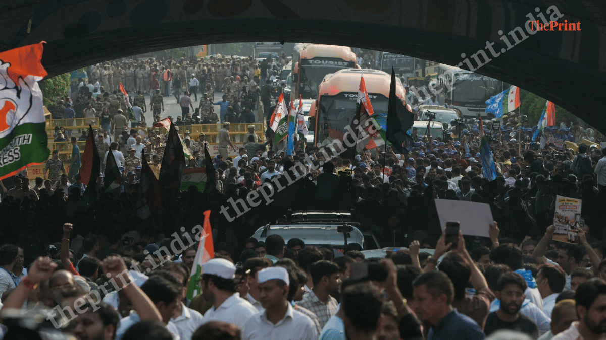 Congress workers and leaders crossing Minto Bridge during march to Rajghat in New Delhi on 8 October, 2026 | Suraj Singh Bisht/ThePrint