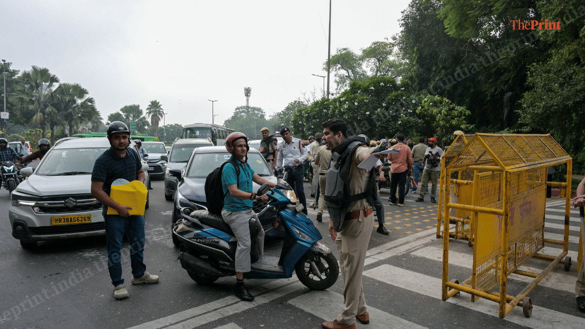 A policeman guiding commuters near Connaught Place in New Delhi on 10 October, 2026 | Suraj Singh Bisht/ThePrint