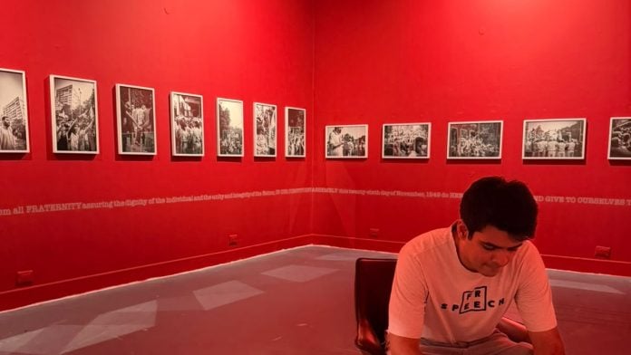 Raihan Vadra sitting infront of empty walls as he was asked to removed from the exhibition. | X/@priyankagandhi
