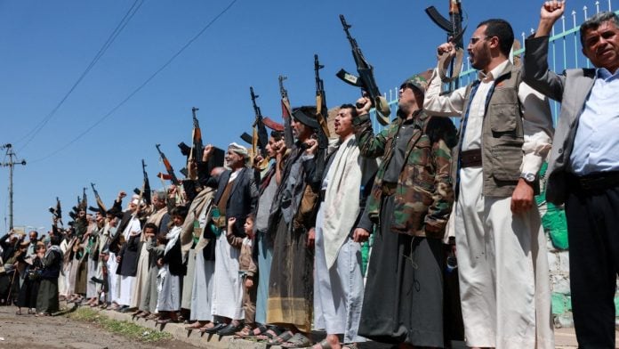 Houthi supporters carry weapons during show of solidarity in Sanaa, Yemen, 0n 7 October, 2026 | Mohammed al-Mahdi/Reuters