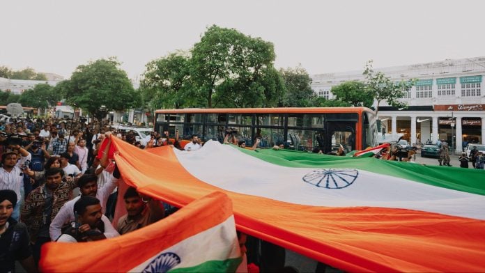 People at Connaught Place take out a Tiranga Yatra on Friday | Photo: Manisha Mondal | ThePrint