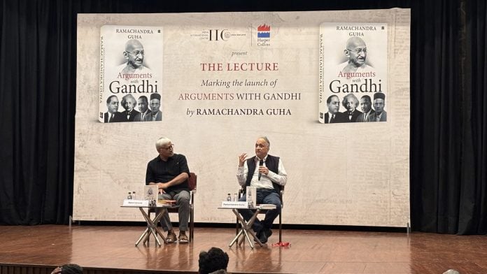 Professor Apoorvanand (left) with historian Ramachandra Guha discuss the latter's book 'Arguments with Gandhi' at IIC | Photo: Vitasta Kaul | ThePrint