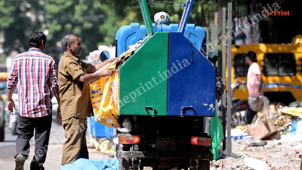 Garbage being loaded onto a collection vehicle in Kalkaji, New Delhi | Suraj Singh Bisht/ThePrint