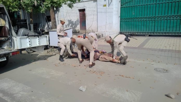 Security personnel removing dead bodies laid out in front of Manipur CM's residence in Imphal by protesters on 19 October, 2026 | By special arrangement