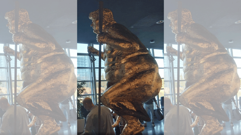 Naked, gilded Trump sculpture installed at EU Parliament as climate protest art