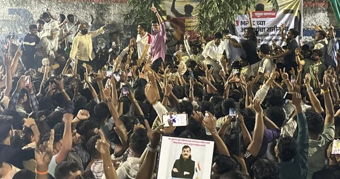 Protestors celebrate after the Maharashtra government on Sunday formed a committee to overhaul the state recruitment body MPSC, naming FDA Commissioner Tukaram Mundhe as secretary, amid an ongoing agitation by aspirants, in Pune, early Monday, Oct. 12, 2026. | PTI Photo