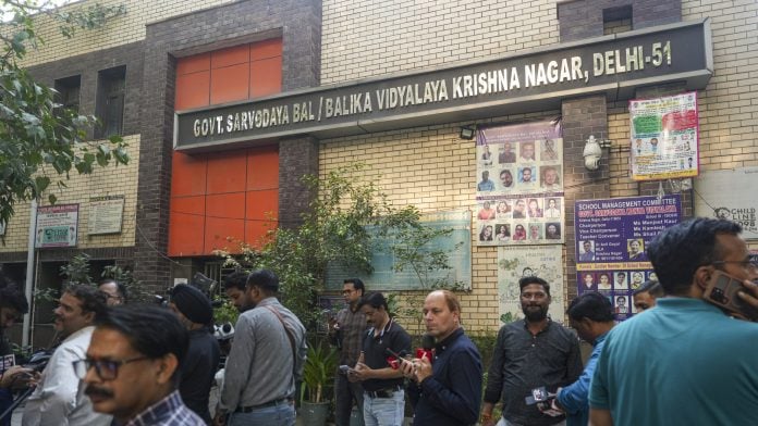 People gather at the premises of Sarvodaya Bal/Balika Vidyalaya after a Class 12 student allegedly died by suicide after setting herself ablaze on the school premises, at Shahdara, in New Delhi, Saturday. | PTI