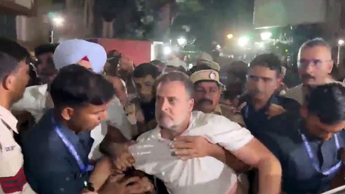 Lok Sabha LoP Rahul Gandhi being detained by Delhi Police during a sit-in protest at Akashvani Bhavan against CEC Gyanesh Kumar, in New Delhi on 6 October, 2026 | X@INCIndia