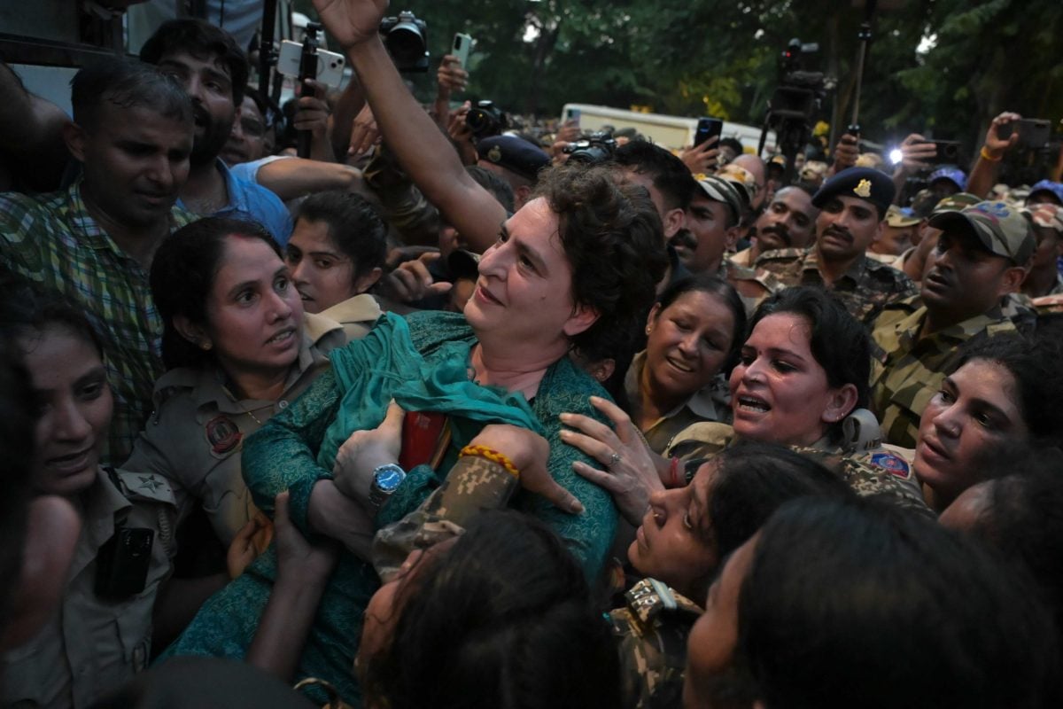 Congress leader Priyanka Gandhi holds a copy of the Constitution of India while being detained by the police | Suraj Singh Bisht | ThePrint