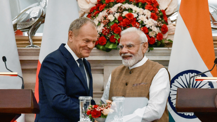 Prime Minister Narendra Modi and Polish Prime Minister Donald Tusk exchange a handshake during the Joint Press Statement at Hyderabad House, in New Delhi on Thursday| ANI Photo