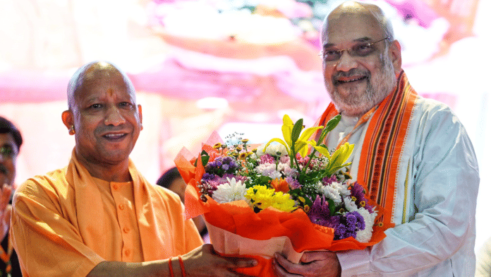 Union Home Minister Amit Shah being felicitated by Uttar Pradesh Chief Minister Yogi Adityanath during the BJP Working Committee meeting in Lucknow on Friday | ANI Photo