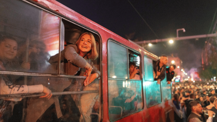 Supporters of the electoral list 'Student List - Students Win' celebrate after Aleksandar Vucic conceded defeat in the parliamentary election in Belgrade, Serbia | REUTERS/Uros Arsic