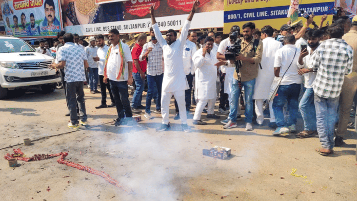 Congress party workers burst firecrackers and celebrate after Leader of Opposition in the Lok Sabha Rahul Gandhi was acquitted in a 2018 criminal defamation case in Sultanpur on Monday | PTI