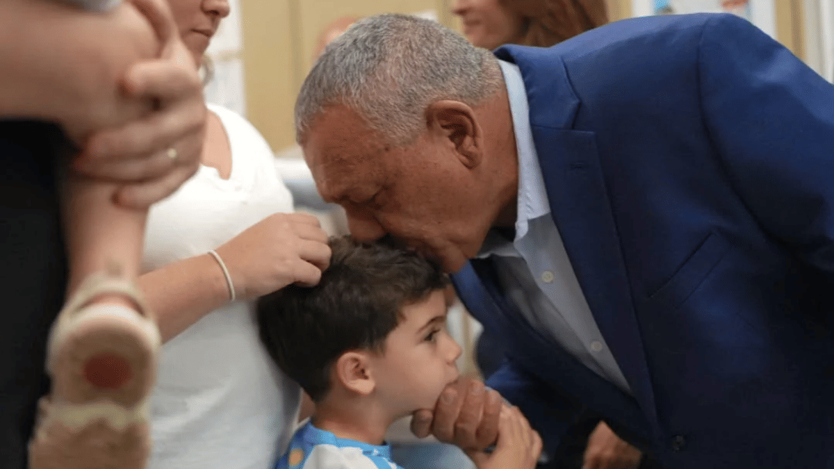 Yashar party leader Gadi Eisenkot with a boy during the voting on Tuesday | Special Arrangement