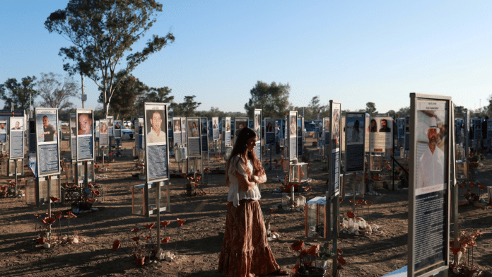 A woman visits the site of the Nova music festival, where partygoers were killed and kidnapped during the deadly Hamas-led 7 October, 2023 attack, on the third anniversary of the attack, near Reim, southern Israel | Reuters/Ronen Zvulun