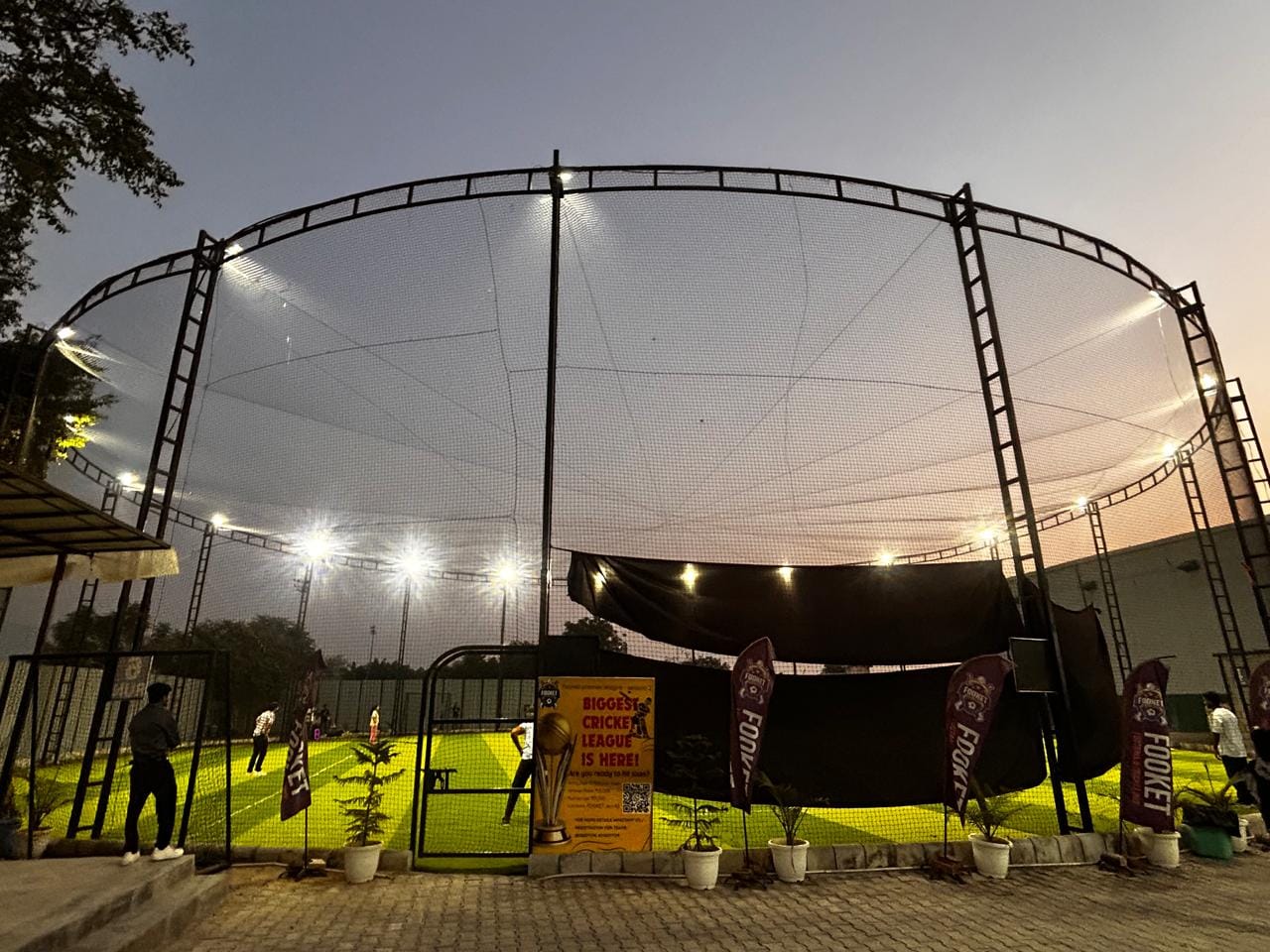 Floodlights illuminate a box cricket turf in Gurugram, where players can book the enclosed ground for evening games | Photo: Manisha Mondal | ThePrint