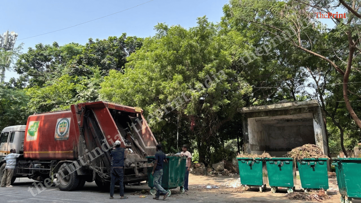 Workers loading garbage onto an MCD truck after separating them | Samridhi Tewari/ThePrint