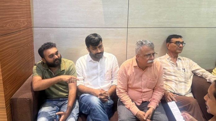 Smit Machchhar's neighbours talking to the media in the lobby of their Ghatkopar building | Tarini Unnikrishnan, ThePrint