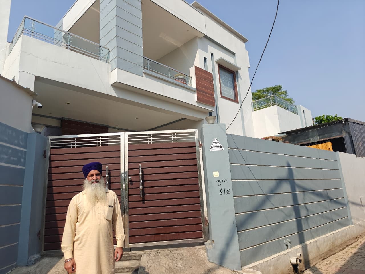 Joga Singh's younger brother outside his locked house. His wife shifted to Canada after his murder, which remains unsolved | Mayank Kumar | ThePrint