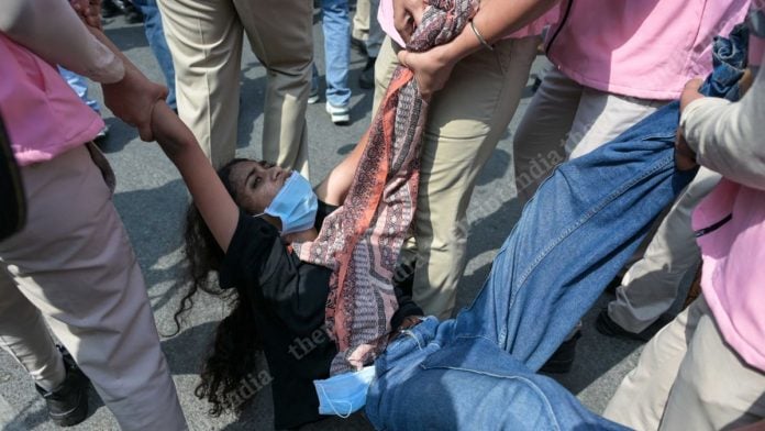 A protester being detained by Delhi Police during the CJP Jantar Mantar 2.0 protest on October 10, 2026